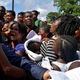 Migrants from Africa and Haiti try to enter an immigrant detention center in Tapachula, Mexico to request humanitarian visas to cross the country towards the United States, June 27, 2019.